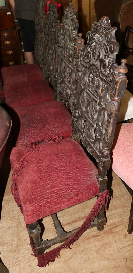A set of six late 19th century Carolean style carved oak dining chairs, H. 3ft 9in.